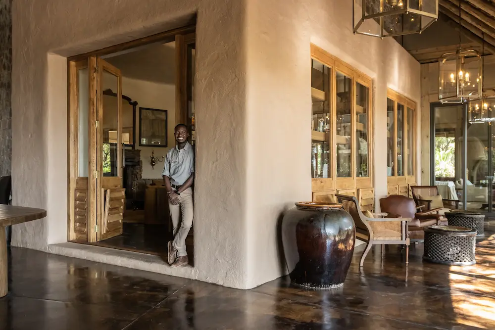 Singita Ebony Lodge_Entrance to Conservation Room_Smiling Staff Member_Emma Jackson (2)